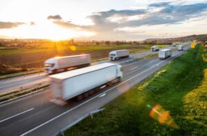 Transportation trucks in high speed driving on a highway 