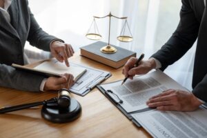 Lawyer reviewing business contract details for accuracy.
